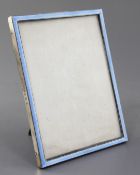 An early 1930's silver and blue guilloche enamel mounted rectangular photograph frame by William