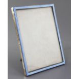 An early 1930's silver and blue guilloche enamel mounted rectangular photograph frame by William