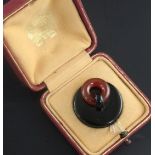 A cased mid 1930's French Cartier silver, black enamel and carnelian "plug" pill box, signed Cartier