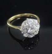 A gold and nine stone diamond cluster ring, size K.