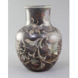A Martin Brothers stoneware vase, c.1894, incised with flowers and foliage on a brown ground, the