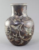 A Martin Brothers stoneware vase, c.1894, incised with flowers and foliage on a brown ground, the