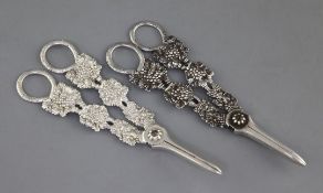 Two similar pairs of George IV silver grape shears by Charles Rawlings, of fruiting vine design,