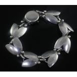 A 1950's Danish Georg Jensen sterling silver tulip bracelet, design no. 93, 7in.