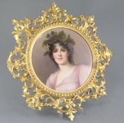 A Berlin KPM porcelain plaque, late 19th century, decorated with a bust of a bacchante, diameter