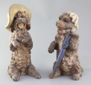 A pair of German or Austrian cold-painted terracotta figures of begging dogs, late 19th / early 20th