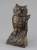 A late 19th century cast iron owl money bank, c.1880, with original painted finish, glass inset eyes