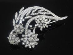 An 18ct white gold and diamond encrusted floral spray trembleuse brooch, 62mm.