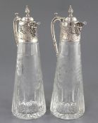 A pair of 1980's silver mounted etched glass claret jugs by C.J. Vander Ltd, of tapering form with