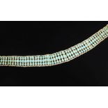 An Indian gold, seed pearl and turquoise choker necklace, set with three graduated rows of oval