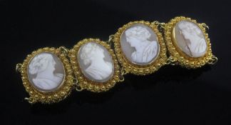 An early 20th century gold and cameo set bracelet, with six oval cameos, each carved with the bust