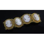 An early 20th century gold and cameo set bracelet, with six oval cameos, each carved with the bust