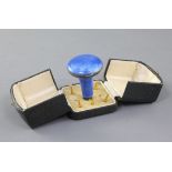 A cased George V continental silver and blue guilloche enamel combination parasol handle/compact,