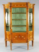 An Edwardian marquetry inlaid satinwood display cabinet, with central mother of pearl inset glazed