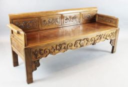 A Chinese hardwood bench, 19th century, inset with floral carved panels, W.6ft 2in. D.2ft H.2ft
