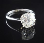 A 1940's/1950's platinum and solitaire diamond ring, the cushion cut stone with an estimated