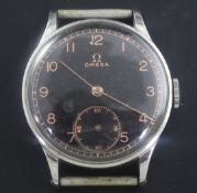 A gentleman's early 1940's stainless steel Omega manual wind wrist watch, with black Arabic dial,