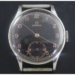 A gentleman's early 1940's stainless steel Omega manual wind wrist watch, with black Arabic dial,