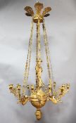 A fine Empire ormolu chandelier, modelled with Mercury standing upon a lappet carved sphere with six