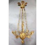 A fine Empire ormolu chandelier, modelled with Mercury standing upon a lappet carved sphere with six