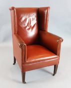 A George III mahogany wing armchair, with russet leather upholstery, W.2ft 2in. D.2ft 4in. H.3ft