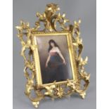 A Berlin KPM plaque, late 19th century, decorated with a girl holding a mandolin, 24 x 16cm,