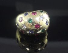 An 18ct yellow gold and multi coloured gem set ring of bombe form, size P/Q