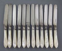 A set of twelve Victorian mother of pearl handled silver dessert knives by Aaron Hadfield,