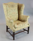 A George III mahogany wing armchair, on moulded squared legs, W.2ft 11in. D.2ft 4in. H.4ft