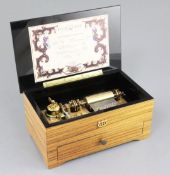 A Reuge of Switzerland musical box, with five interchangeable cylinders playing ten airs, numbered