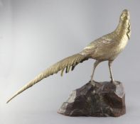 Georges Lavroff. A French Art Deco patinated bronze model of a pheasant, signed, on naturalistic