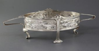 An Edwardian Art Nouveau pierced silver two handled oval dish by William Hutton & Sons, with