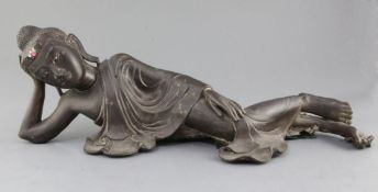 A Thai bronze figure of a reclining Buddha, with applique decoration, 55cm