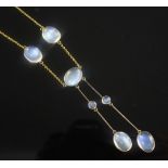 An Edwardian 9ct gold and moonstone drop necklace, set with seven oval cabochons, 16in.