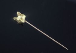 A French 18ct gold Cartier fox head stick pin, marked 'Cartier Paris' and numbered 0433, 2.5in.