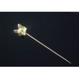 A French 18ct gold Cartier fox head stick pin, marked 'Cartier Paris' and numbered 0433, 2.5in.