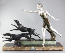 Uriano. A French Art Deco patinated bronzed spelter group of a lady and two running hounds,
