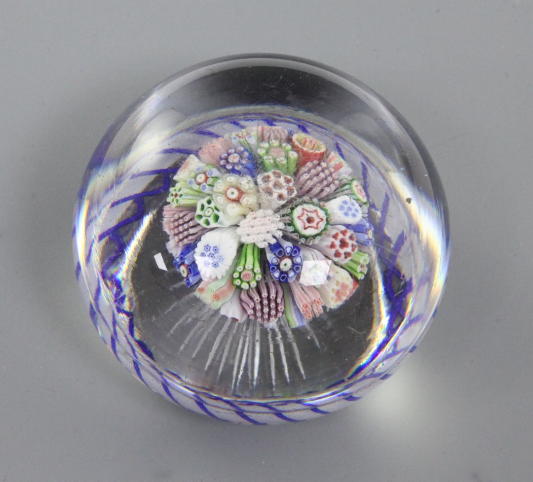 A Baccarat mushroom millefiori glass paperweight, 19th century with a spiralled cable surround and