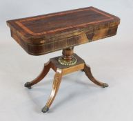 A Regency brass inset rosewood card table with D shaped top and downswept legs W. 3ft. D. 1ft 6in.