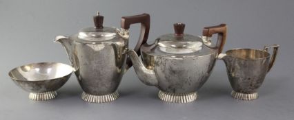 A matched 1930's Art Deco silver four piece tea set, of circular form, with cusped foot, W.