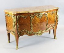 A Louis XV style ormolu mounted kingwood and marquetry bombe commode, with serpentine marble top and