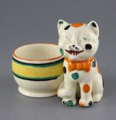 A Clarice Cliff 'Laughing Cat' pen holder, circa 1932, black printed mark 'Bizarre by Clarice