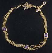 An early 20th century gold triple strand Albertina ropetwist chain, with floral enamelled plaques,