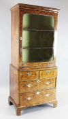 An early 18th century walnut bookcase, with single glazed door over two short and two graduated long