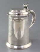 A George III silver tankard by William & James Priest, with fluted scroll thumbpiece and later