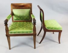A set of fourteen Empire style brass inset mahogany dining chairs, including two carvers, with green