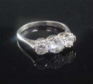 A 1940's platinum and three stone diamond ring, with an approximate total diamond weight of 1.