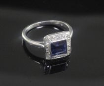 A 1920's/1930's platinum, synthetic? sapphire and diamond cluster ring, size E.