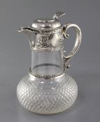 A Victorian silver mounted cut glass claret jug by W & G Sissons, with repousse floral decoration