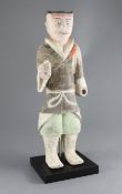 A large Chinese polychrome painted standing figure of a warrior, from Xian, Han dynasty (206BC-